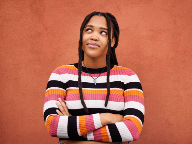 istock Thinking, black woman and face on background for ideas, mindset and planning on mockup. Inspiration, brainstorming and female model curious for question, solution and remember memory on mock up wall 1485052581