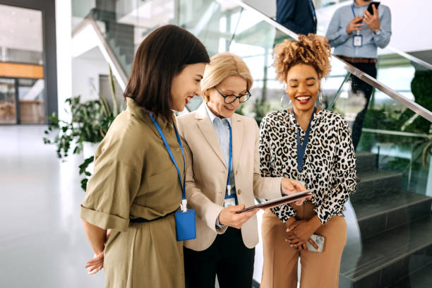 istock Businesswomen in the office discussing work corridor 1485053640