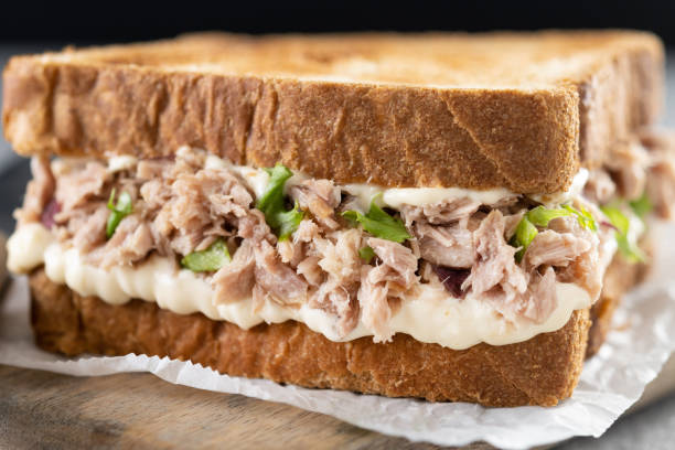 istock Tuna sandwich with mayo and vegetables on gray surface 1485054336