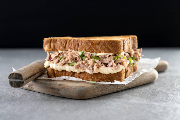 istock Tuna sandwich with mayo and vegetables on gray surface 1485054390