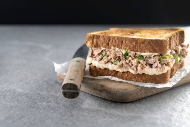 istock Tuna sandwich with mayo and vegetables on gray surface 1485054398