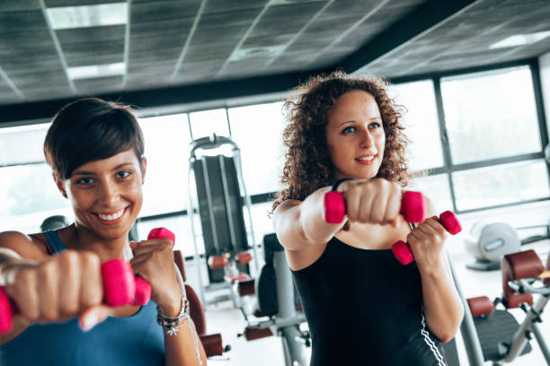 istock friends in the gym with dumbells 1485054676