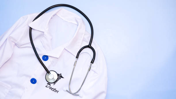 istock Doctor's coat and stethoscope on a blue background 1485059587