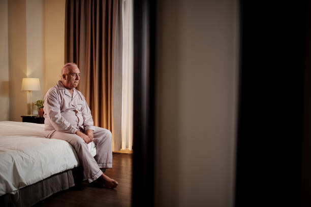 istock Sad Depressed Man Sitting on Bed 1485063787