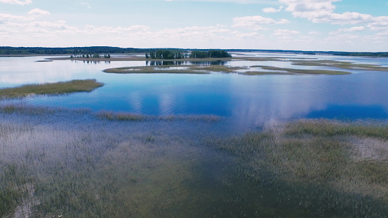 Aerial view at Braslav lakes in National Park. Blue beautiful water. Drone flies over incredible landscape in national park Popular tourist place in Belarus. High quality 4k footage