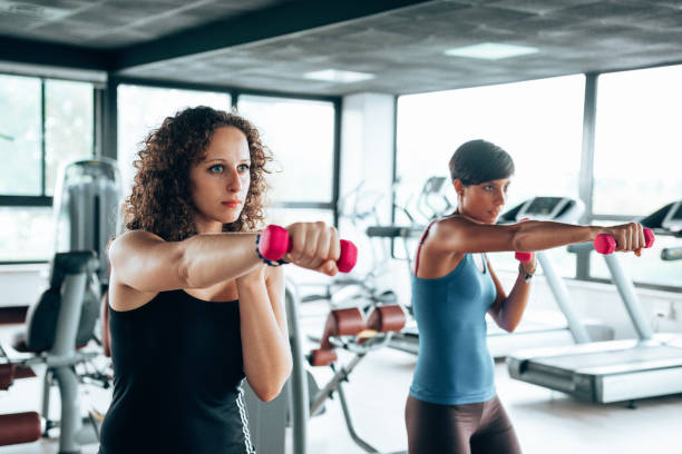 istock friends in the gym with dumbells 1485069308