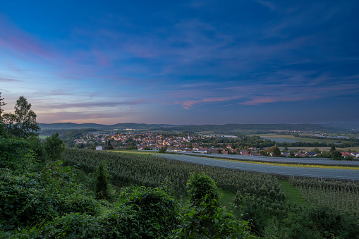 View on Wahlwies village during a summer sunset in the orchards surrounding the village close to the Bodensee in Baden-Württemberg, Germany.