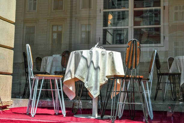 istock Empty tables with white tablecloth and chairs on terrace of summer outdoors cafe 1485069893