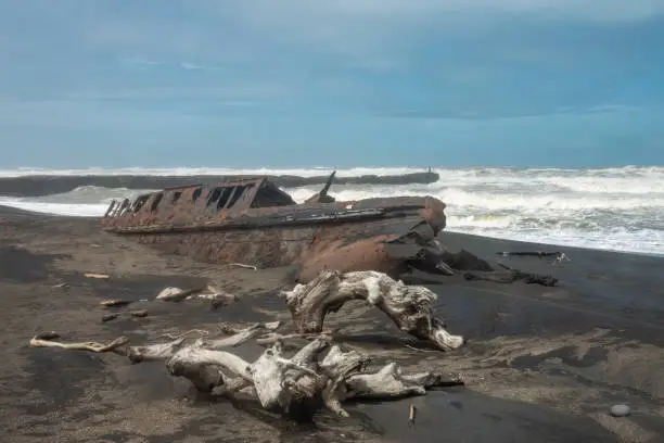 Photo of Fascinating ship wrecks on the stormy black sand beaches of the Cook Strait, North Island, New Zealand