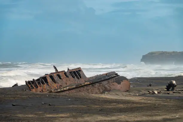 Photo of Fascinating ship wrecks on the stormy black sand beaches of the Cook Strait, North Island, New Zealand