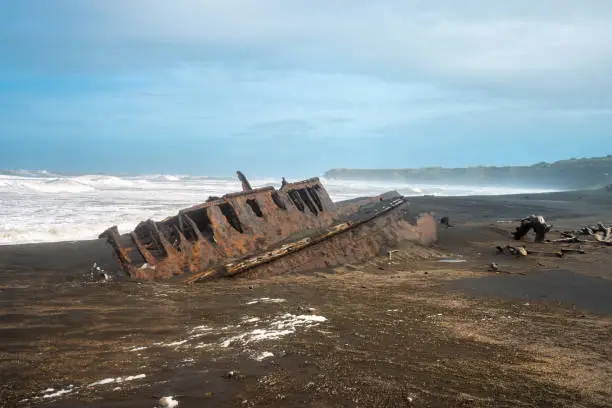 Photo of Fascinating ship wrecks on the stormy black sand beaches of the Cook Strait, North Island, New Zealand