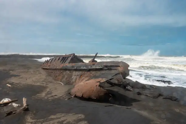 Photo of Fascinating ship wrecks on the stormy black sand beaches of the Cook Strait, North Island, New Zealand