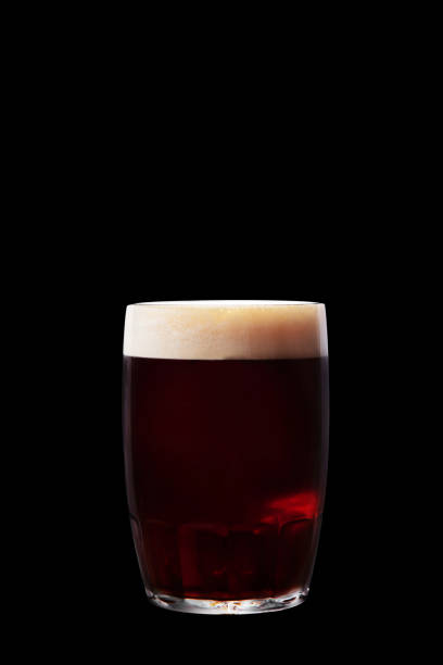 istock Dark beer in a glass on a black background 1485071352