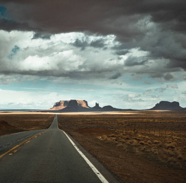 Traveling in USA Southwest: Driving a car in Arches National Park during summer
