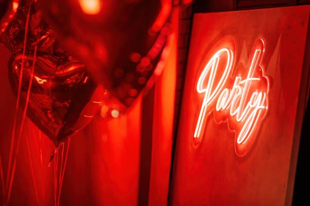 istock Neon party sign and heart shaped balloons 1485077826