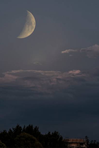 istock Beautiful large crescent moon in the cloudy sky 1485078259