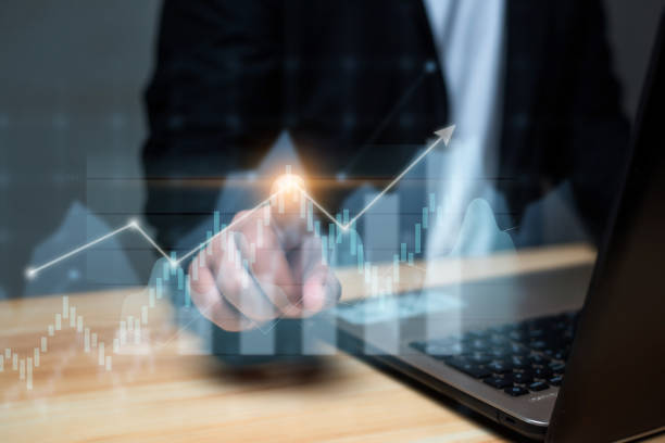 istock Business development to success concept, Businessman  using laptop pointing a growing graph on hud display.  financial growth. 1485078970