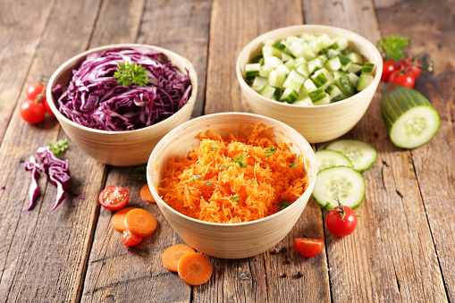 various bowl of vegetable salad- cabbage, carrot and cucumber