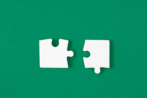 White puzzle pieces comes together