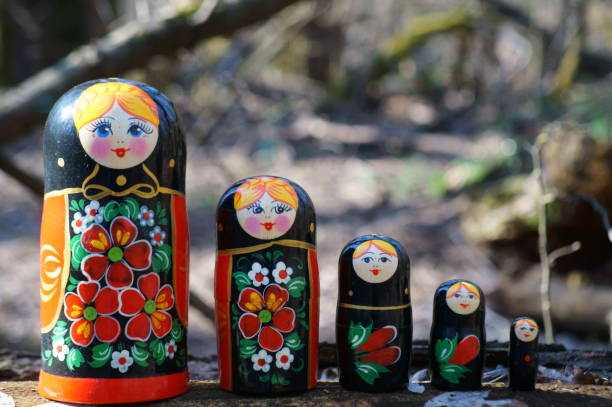 istock Matryoshka dolls decorated with patterns stand in a row. 1485086793