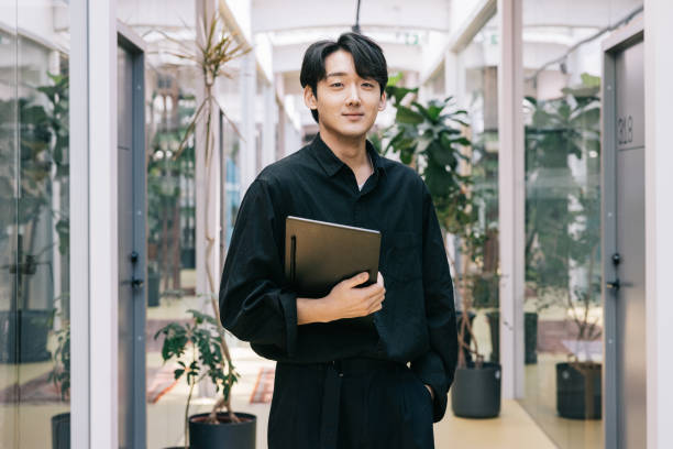 Young Korean businessman at the office stock photo