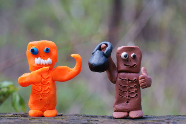 istock Zombie figures with toy dumbbells. 1485087285