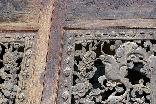 intricate  carving at wooden door