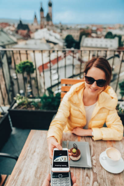 istock Woman in Krakow old town using digital wallet for mobile payment 1485087454