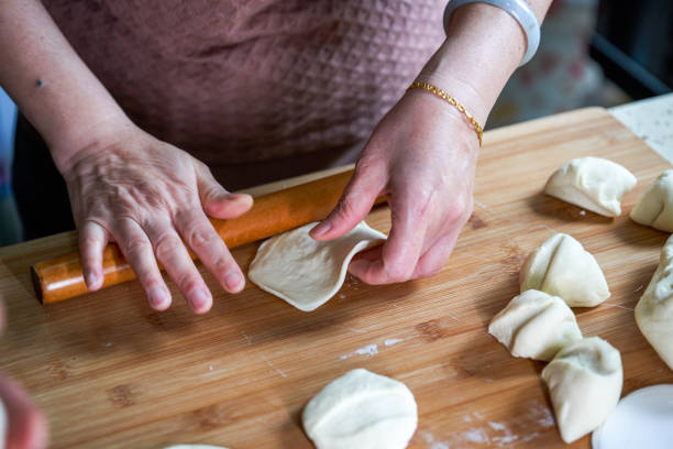 istock A chef in a Chinese kitchen is making bun skins with a rolling pin 1485091409