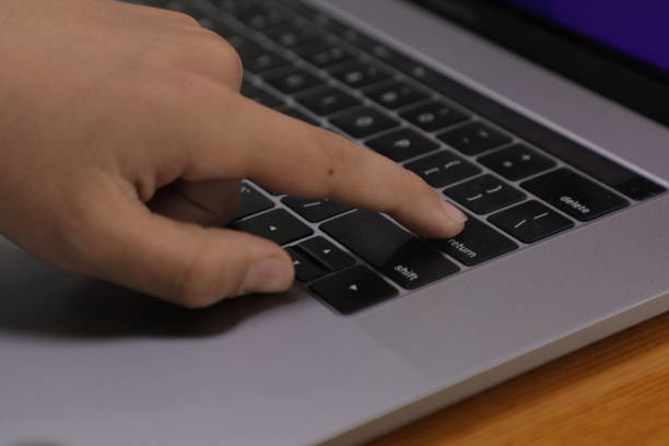 istock A person is using a keyboard with the word enter on the left side. 1485093345