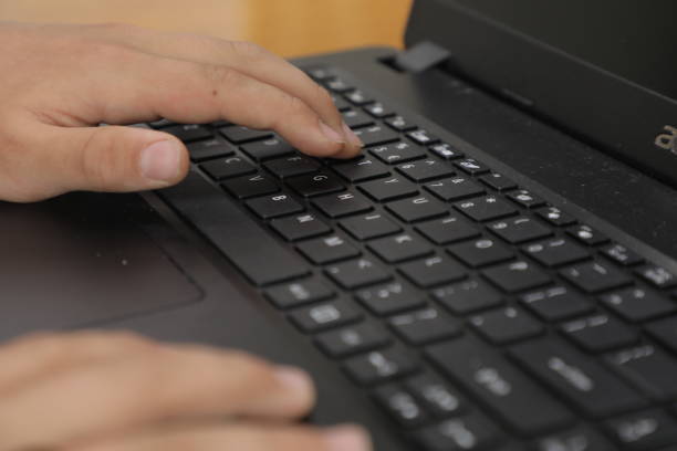 istock A person typing on a laptop with the letters  enter  on the left side. 1485093359