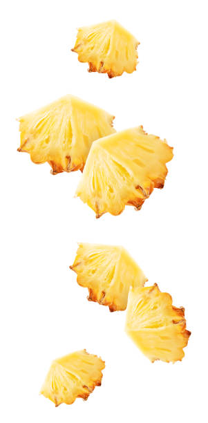 istock Isolated flying pineapple. Falling sliced ananas fruit isolated on white background with clipping path 1485095972