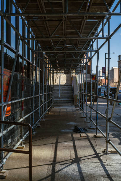 istock Construction Scaffolding on a Public Sidewalk in a City 1485099916