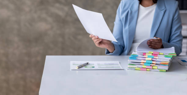 istock business documents businessman check legal document review Prepare documents or analysis reports, tax items, accounting documents, data contracts, office partner agreements. 1485100225
