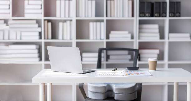 istock workspace,Wooden desk and computer in the office working space with mock-up laptop computer devices, workspace concept. 1485100287