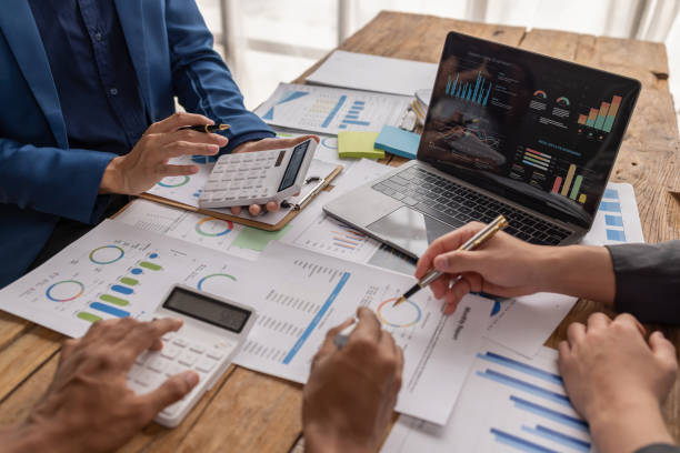 istock Team of Business people working at workplace with tablet and document, doing planning analyzing Tax financial report, business plan investment, finance analysis Economic business discussions. 1485100311