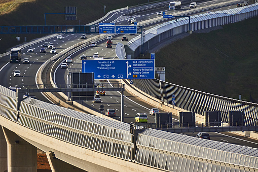 Gouda, Netherlands - April 22, 2015: Traffic and Gouwe aqueduct on motorway A12 - route information to The Hague and Rotterdam in the Netherlands