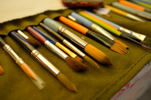 istock Paint brushes in a row .Palette at background 1485103204