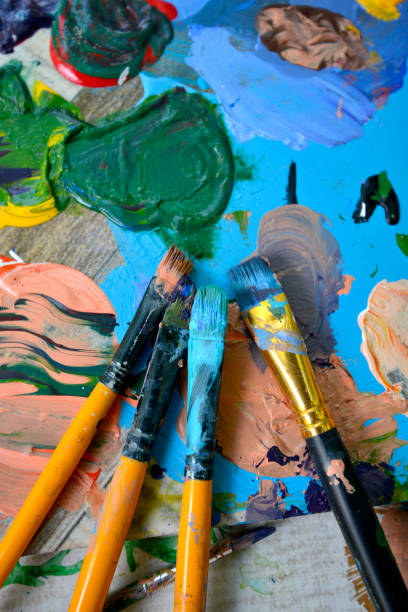 istock Paint brushes in a row .Palette at background 1485103223