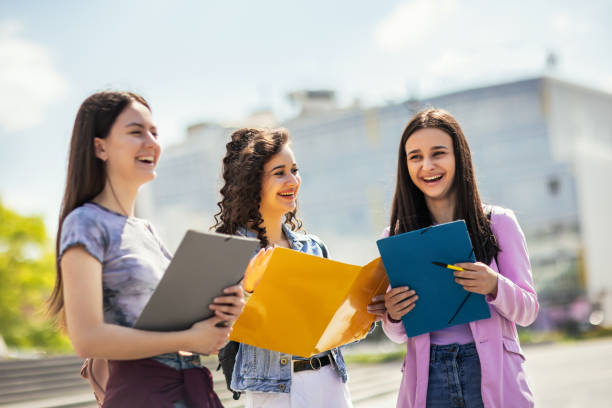 istock Group of students with notebook studying together outdoors. 1485107963