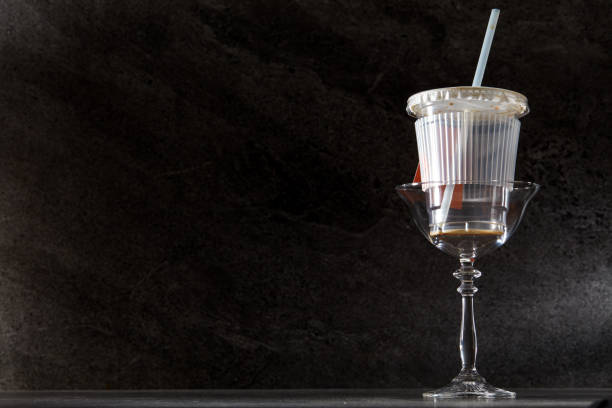 istock Empty cocktail glasses and containers in front of a dark marble tile background 1485108198