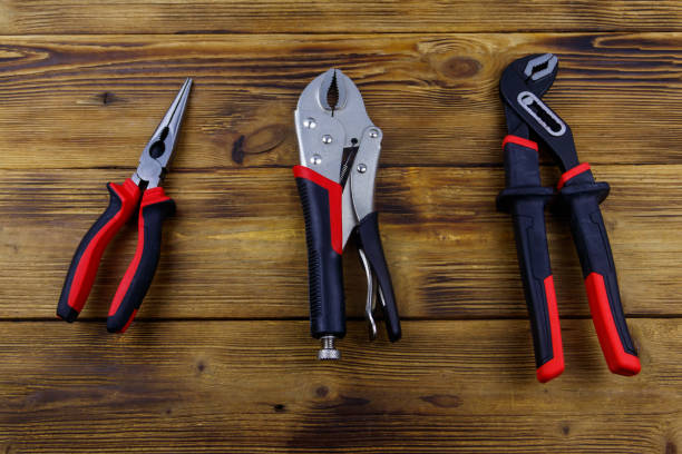 istock Set of different pliers on wooden background. Top view 1485108428