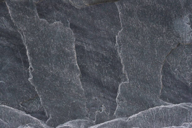 istock Dark gray stone background with relief. 1485110368