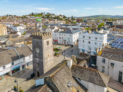 Newton Abbot, UK. April 25, 2023. Aerial view of Newton Abbot clock tower and local shops and high street.