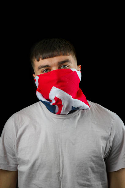 istock Teenage boy British mask black background 1485110381