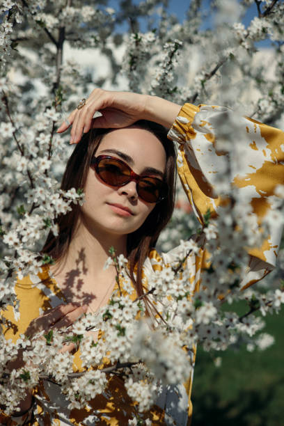 istock Content female model looking at camera in spring garden 1485111245