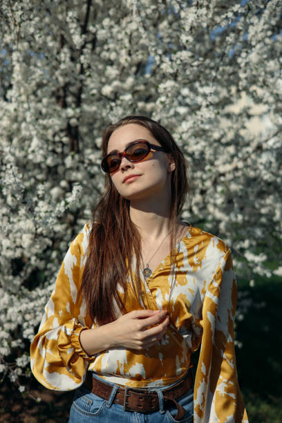 istock Tranquil woman in spring flowering park on sunny day 1485111252
