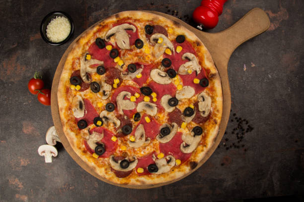 istock pizza with olive and cheese on the rusty background 1485111429