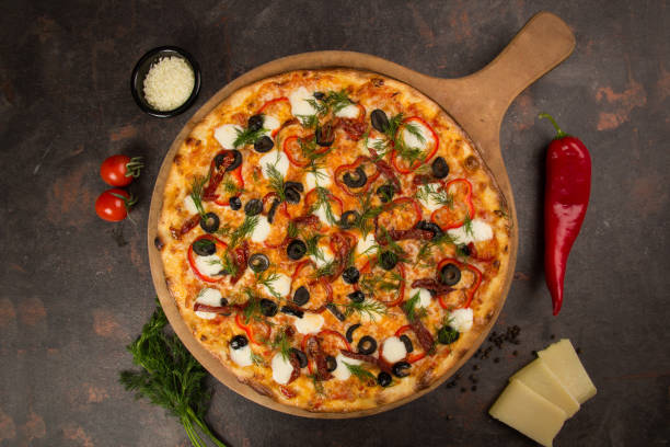 istock pizza with olive and cheese on the rusty background 1485111455