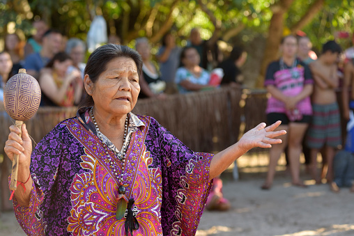 Peruíbe, SP, Brazil - April 21, 2023:  Shaman singing a blessing in the Guarani village of Tapirema
